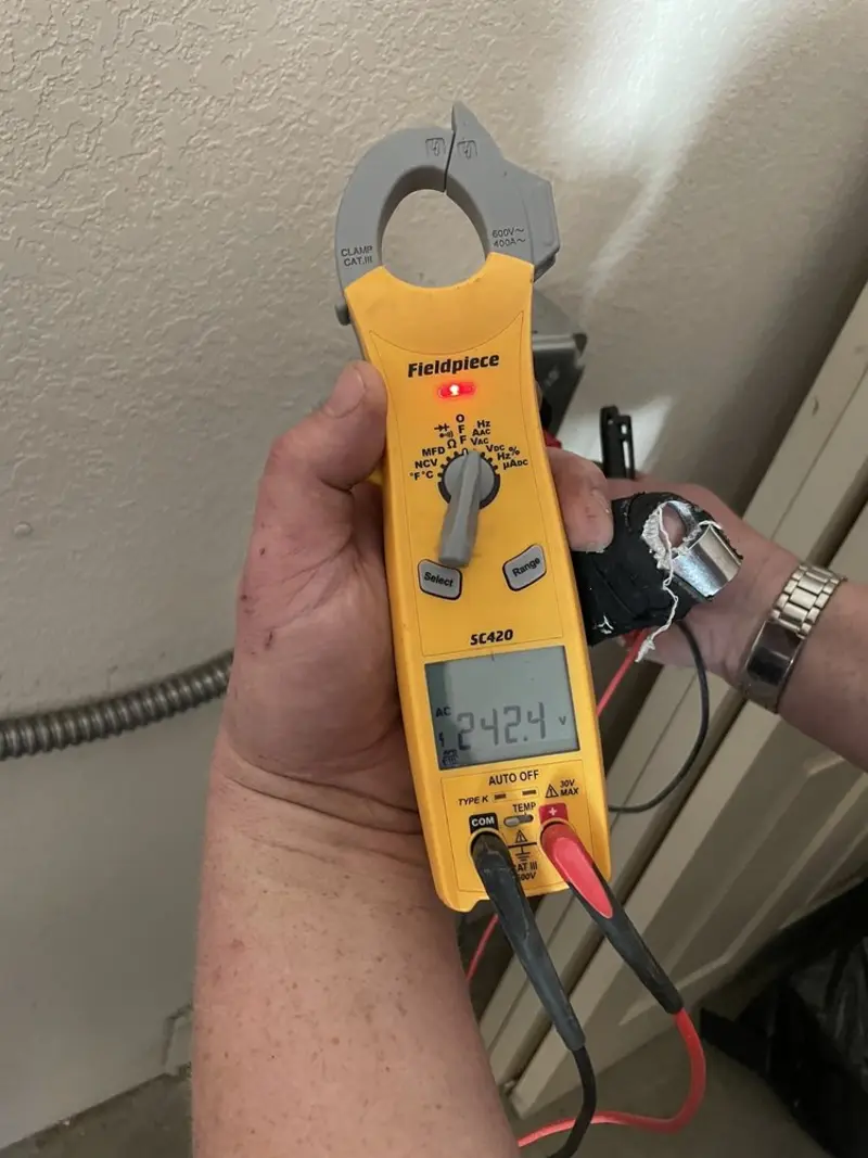 Voltage testing with clamp meter during Recessed Lighting Installation in Rosemont